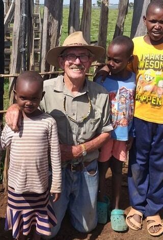 David Mascall with Massai kids after the light installation