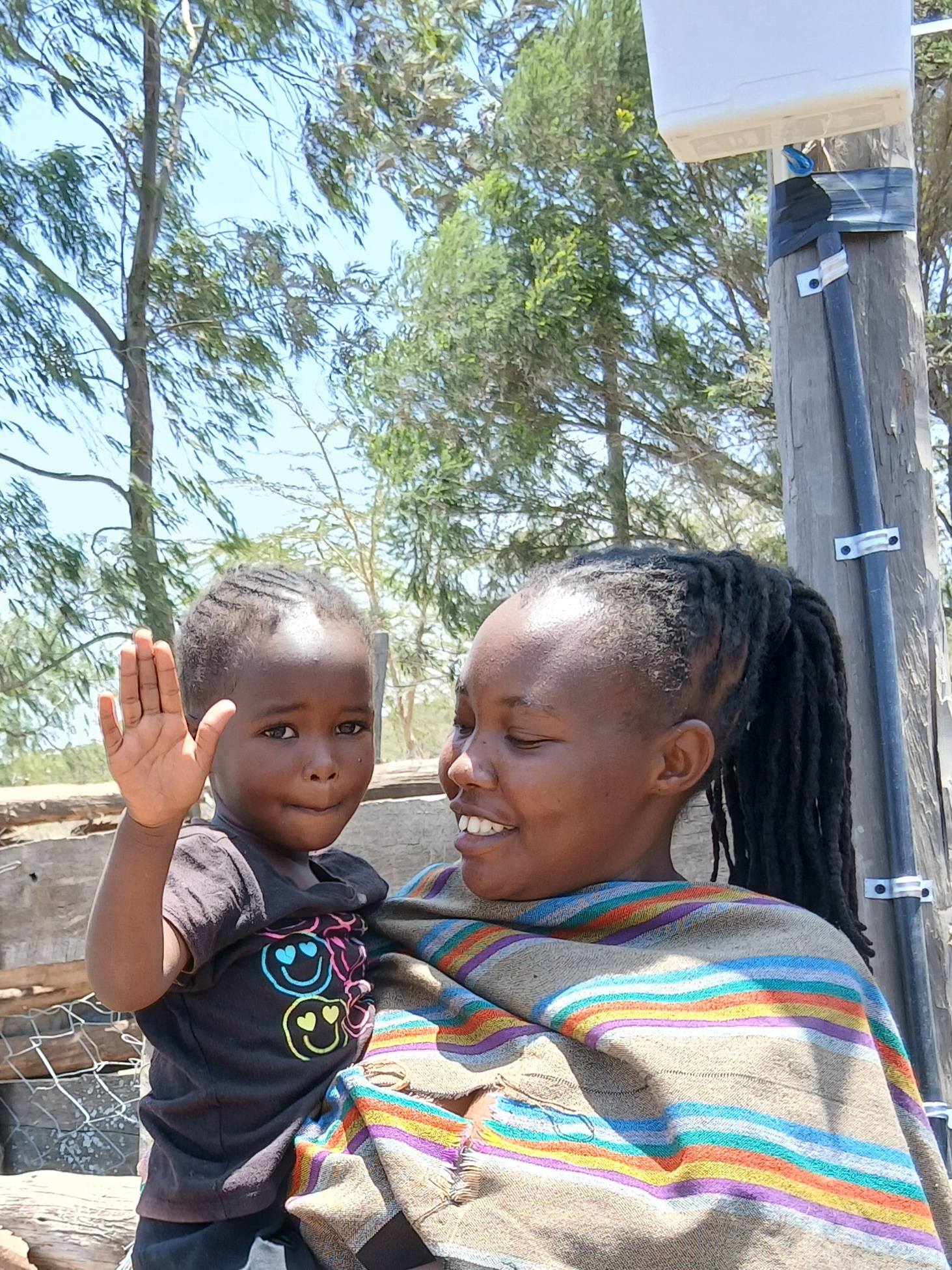 Evelyne Mpiiti and daughter Janet after Lion entry deterrent system installation