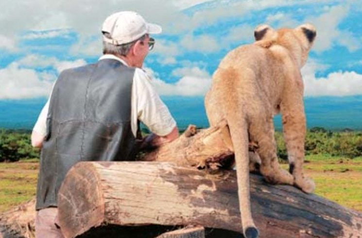 Mr Mascall and the lion cub Remus gaze at the landscape. Photo/CORRESPONDENT